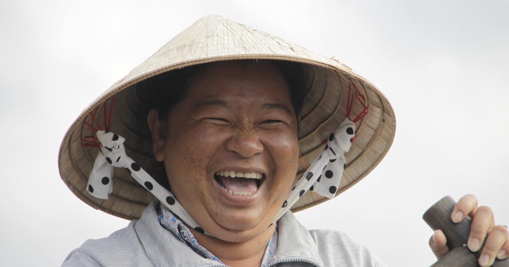 Happy, laughing woman showing the true meaning of life