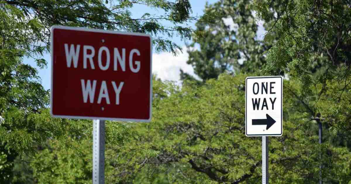 two road signs indicating. that you might be heading in the wrong direction